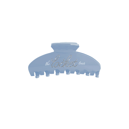 Blue hair clip with Madison Beer's 'the locket tour' branding.